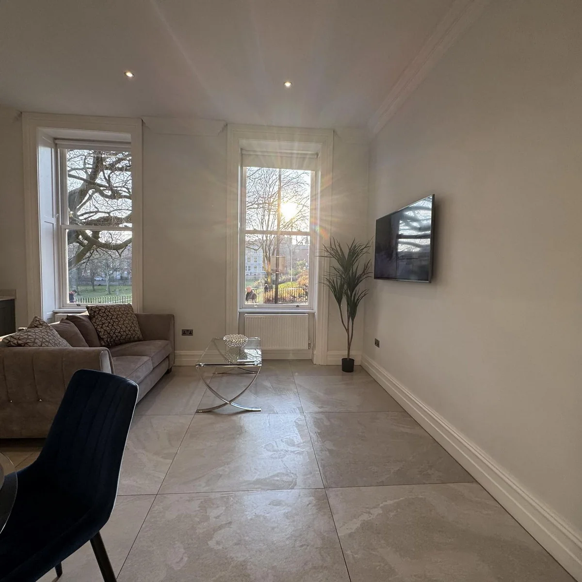 Wide view of the spacious Georgian living room at Winckley Square View Apartment