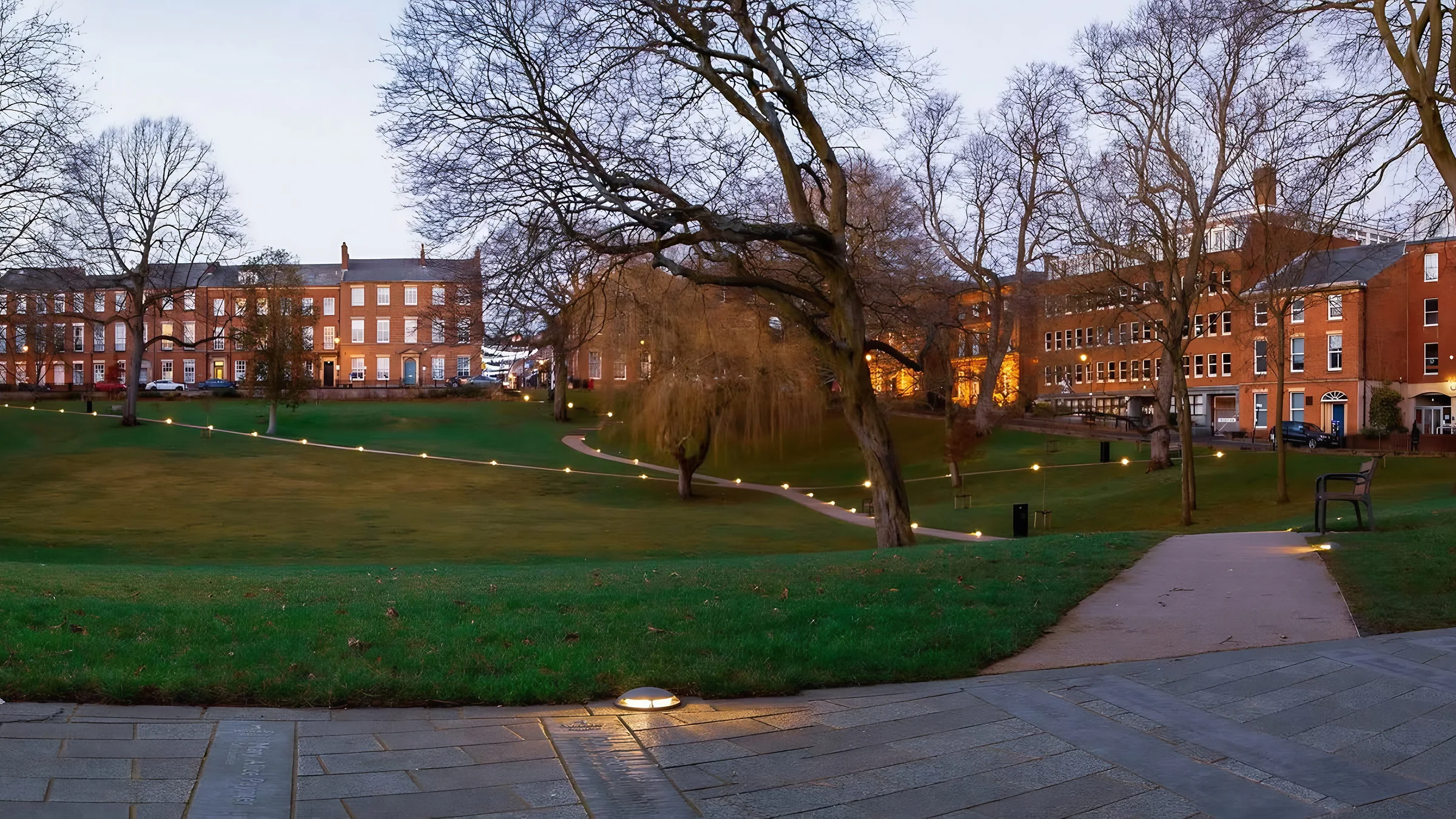 Winckley Square Gardens, Preston, at dusk, with lit paths and Georgian houses